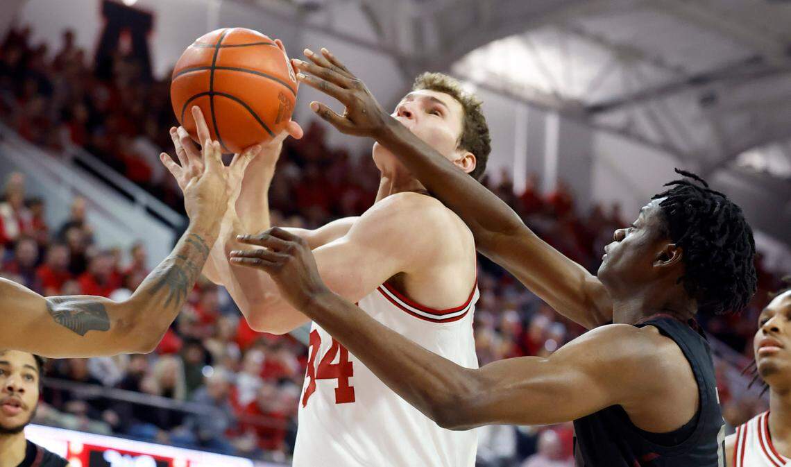 N.C. State’s Ben Middlebrooks (34) is fouled by Maryland Eastern Shore’s Israel Yaw (20) during the first half of N.C. State’s game against Maryland Eastern Shore at Reynolds Coliseum in Raleigh, N.C., Wednesday, Dec. 6, 2023.