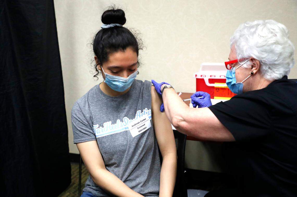Sarah Taylor, 23, gets her second COVID-19 shot from Kathleen Privette, RN, during the WakeMed Back-to-School Blitz vaccine clinic at the WakeMed Raleigh Campus in Raleigh, N.C., Sunday, August 1, 2021.