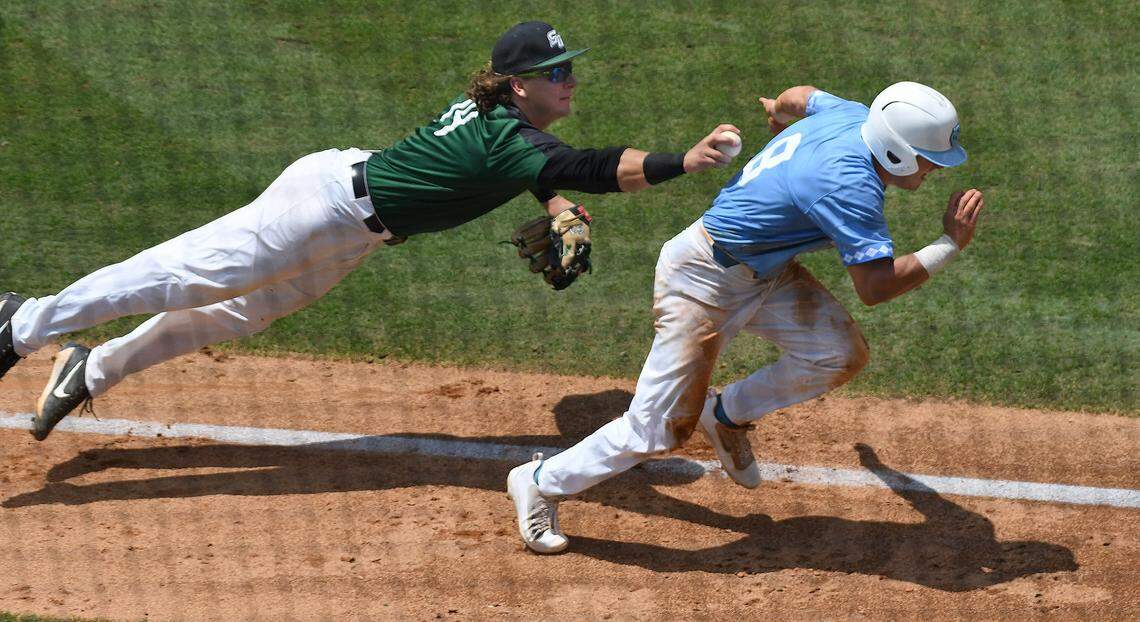 UNC's Ike Freeman (8) gets tagged out during a rundown by Stetson's Jonathan Meal (19) in the sixth inning during the Super Regional game in Chapel Hill, N.C. Friday, June 8, 2018.