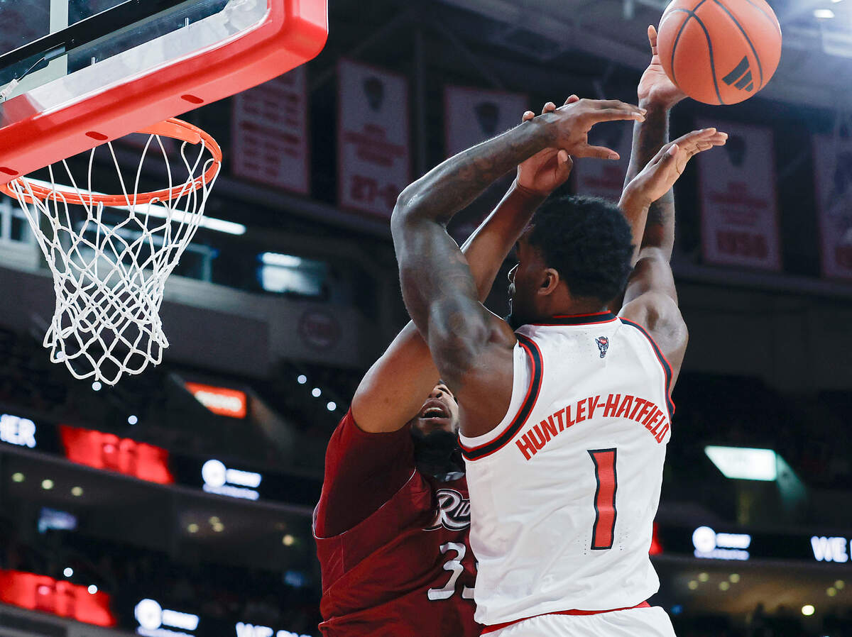 N.C. State’s Brandon Huntley-Hatfield is fouled by Rider’s Tariq Ingraham during the first half of the Wolfpack’s 89-63 win on Sunday, Dec. 22, 2024, at Lenovo Center in Raleigh, N.C. Officials ruled it a flagrant foul.
