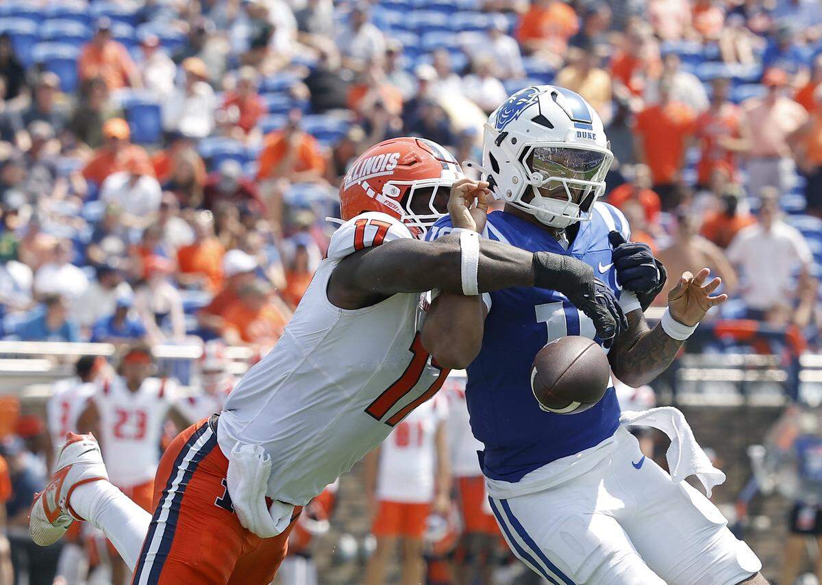 Duke quarterback quarterback Darian Mensah fumbles the ball while being pressured by Illinois’ Gabe Jacas during the first half of the Blue Devils’ 45-19 loss on Saturday, Sept. 6, 2025, at Wallace Wade Stadium in Durham, N.C.