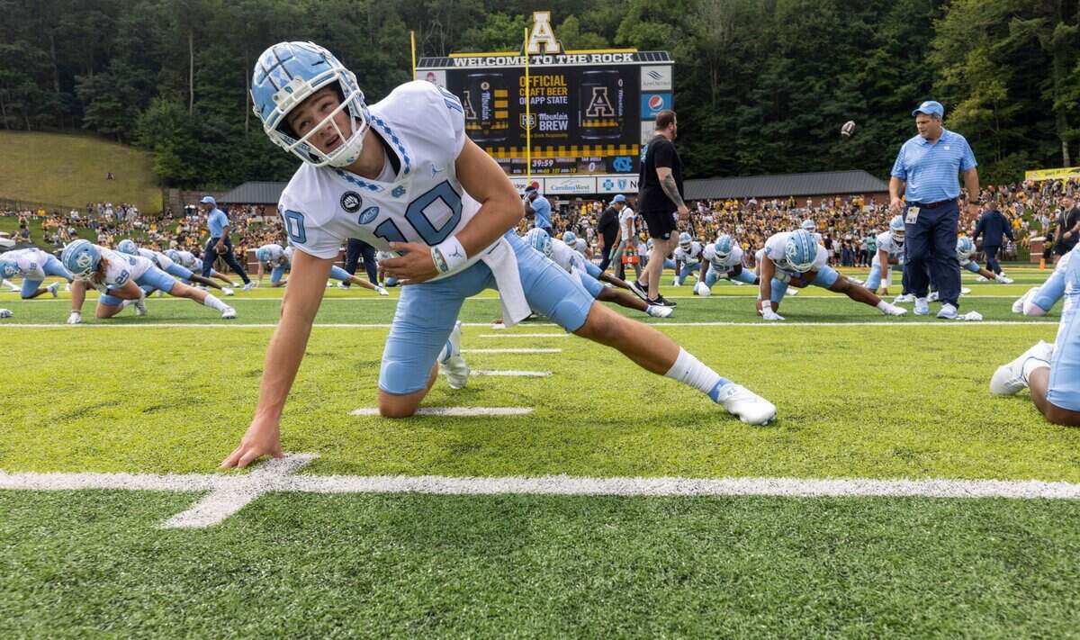 North Carolina quarterback Drake Maye (10) stretches prior to the Tar Heels game against Appalachian State on Saturday, September 3, 2022 at Kidd Brewer Stadium in Boone, N.C.