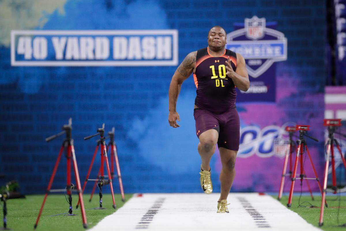 Clemson defensive lineman Dexter Lawrence runs the 40-yard dash at the NFL football scouting combine in Indianapolis, Sunday, March 3, 2019. (AP Photo/Michael Conroy)