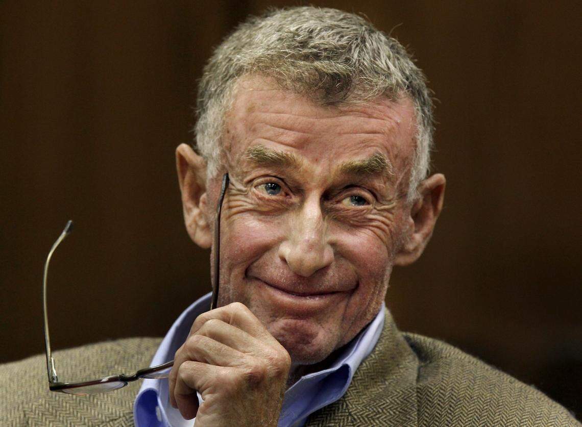 Michael Peterson smiles during the fourth day of his hearing for a retrial Friday Dec. 9, 2011 at the Durham County courthouse.