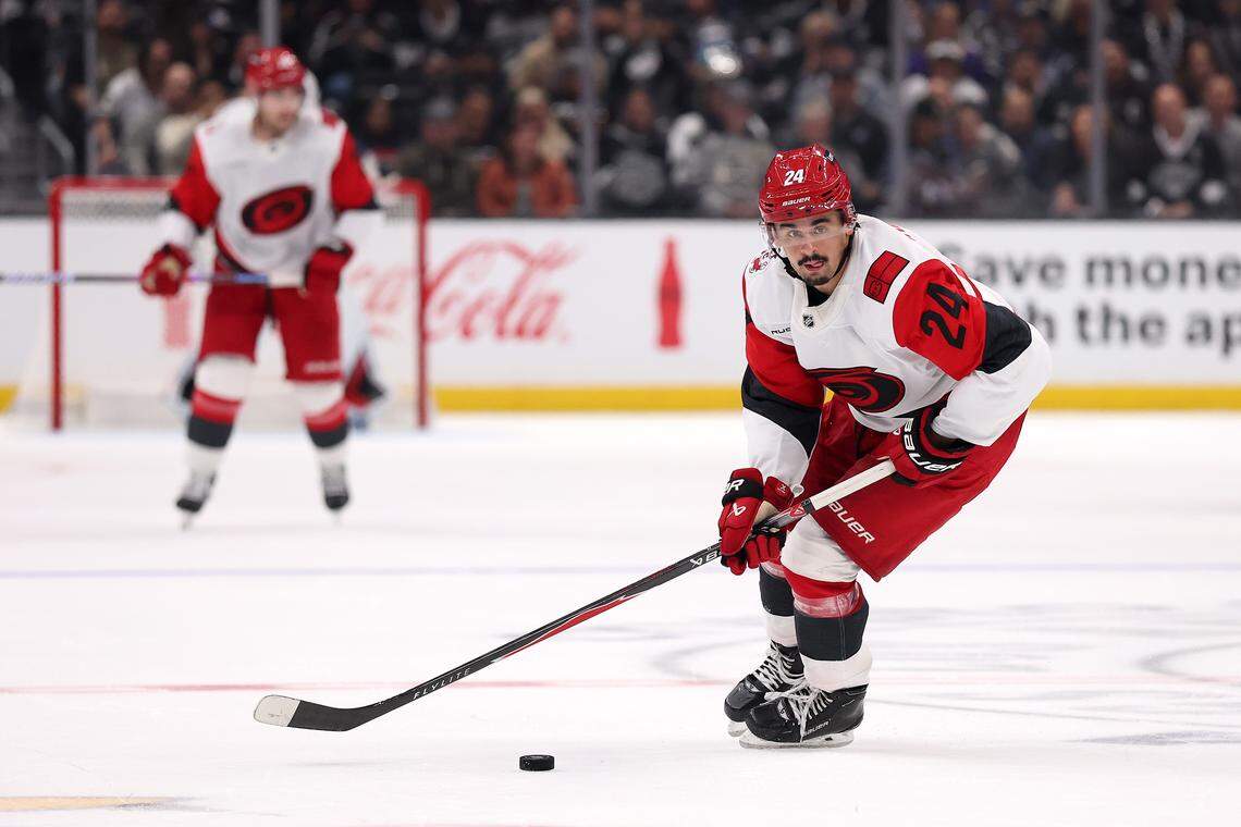 Seth Jarvis of the Carolina Hurricanes skates with the puck against the Los Angeles Kings during the third period at Crypto.com Arena on October 18, 2025 in Los Angeles, California. Jarvis went down injured Thursday against the Islanders after taking two pucks off the left foot.