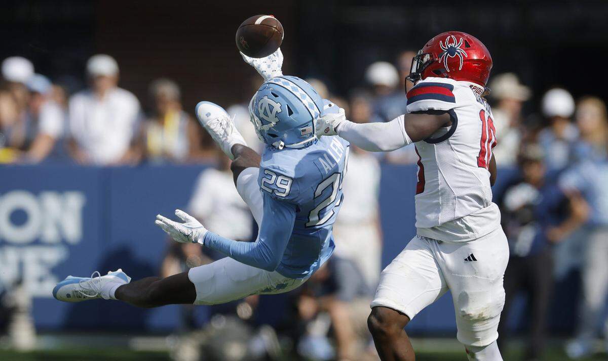 North Carolina defensive back Marcus Allen (29) can’t pull in the interception while defending Richmond wide receiver Isaiah Dawson (10) during the first half of UNC’s game against Richmond at Kenan Stadium in Chapel Hill, N.C., Saturday, Sept. 13, 2025.
