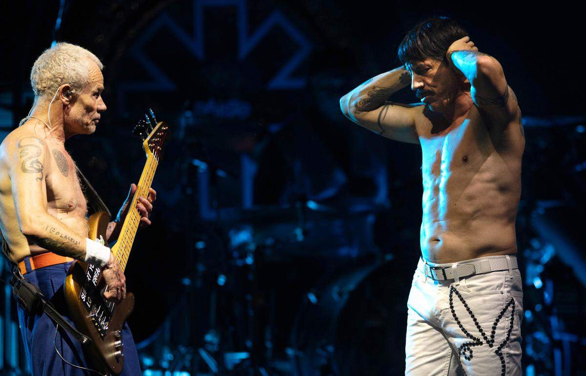 Bassist Flea jams with lead singer Anthony Kiedis early in Red Hot Chili Peppers’ sold-out show in Raleigh, Wednesday night, June 26, 2024.
