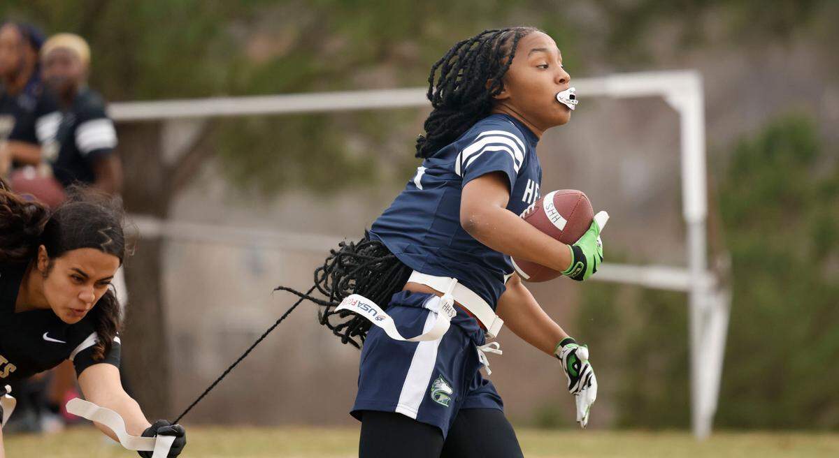 Knightdale High School’s Destiny Artiga (10) tries to stop Heritage High School’s Rizyha Rogers during a flag football scrimmage at Heritage High School in Wake Forest, N.C., Wednesday, Jan. 24, 2024.