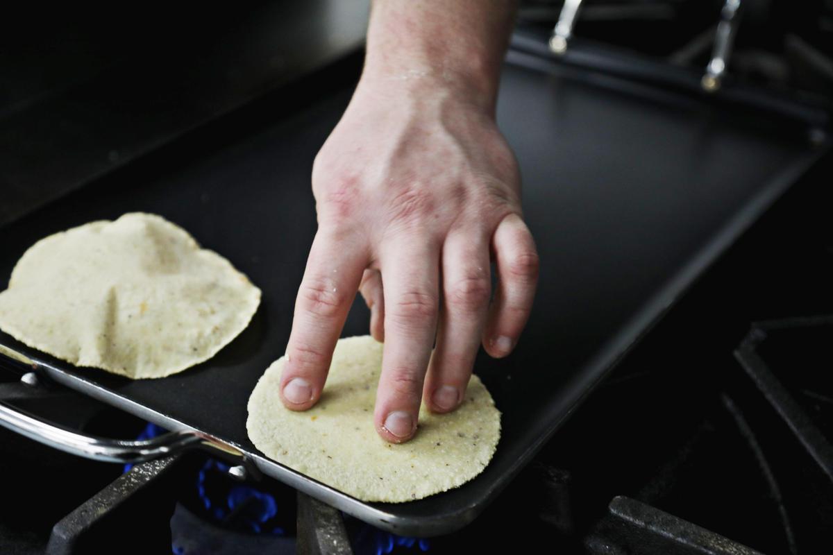 Ex-Voto chef Dallas Howard makes tacos from freshly ground Oaxacan corn in the restaurant’s commissary kitchen at the Kitchen Archive in Raleigh in advance of a pop-up dinner, Feb. 10, 2019.