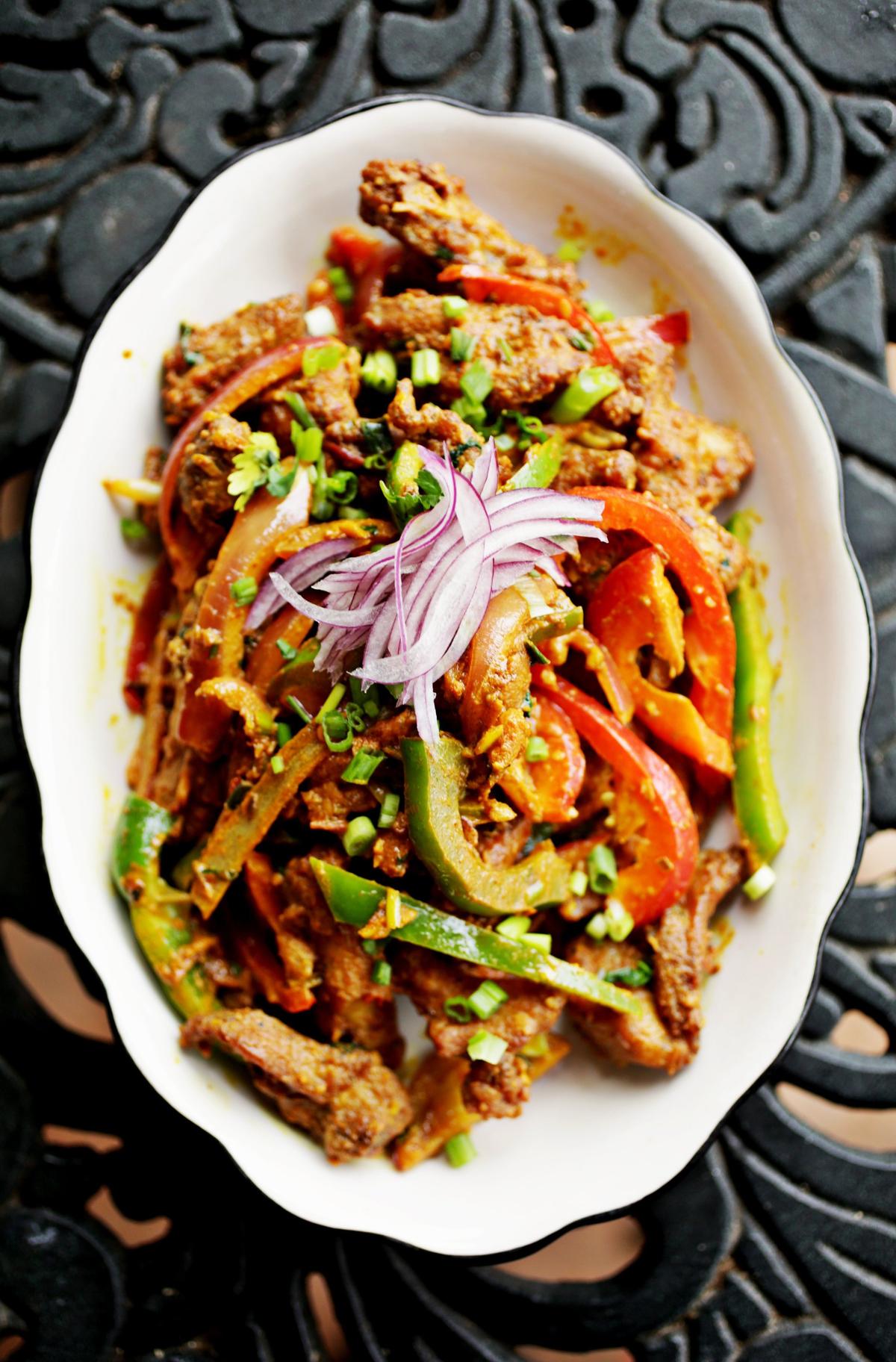 Everest Nepali Kitchen’s chicken tom yumjalfrezie is a Thai-Indian fusion dish perfumed with tropical herbs and spices.