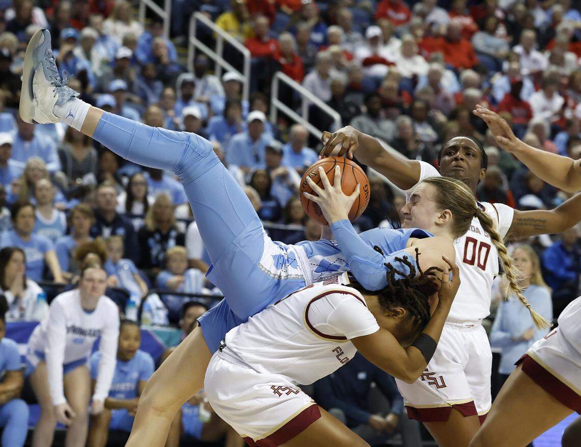 North Carolina’s Alyssa Ustby is fouled as she battles Florida State’s O'Mariah Gordon and Ta'Niya Latson for a rebound during the second half of the Tar Heels’ 60-56 win in the ACC Tournament quarterfinals on Friday, March 7, 2025, at First Horizon Coliseum in Greensboro, N.C.