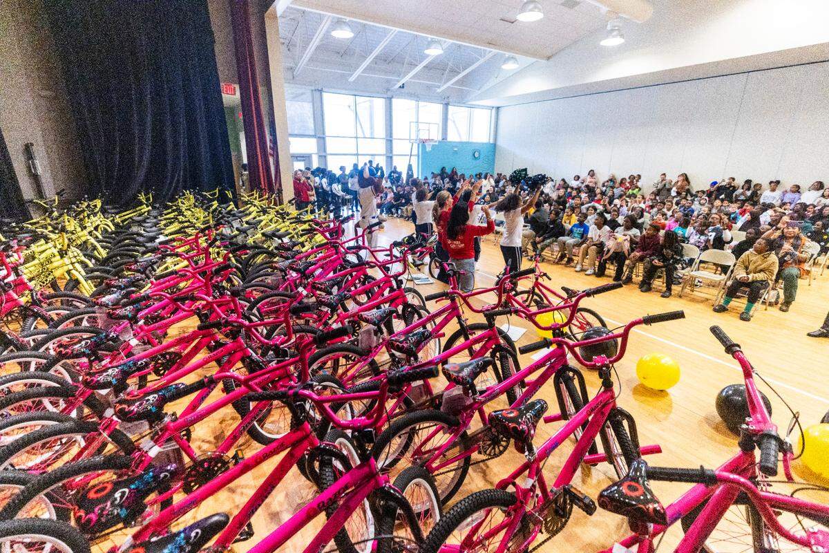 Third-graders at Walnut Creek Elementary School are receiving new bicycles from Triangle Spokes Group.