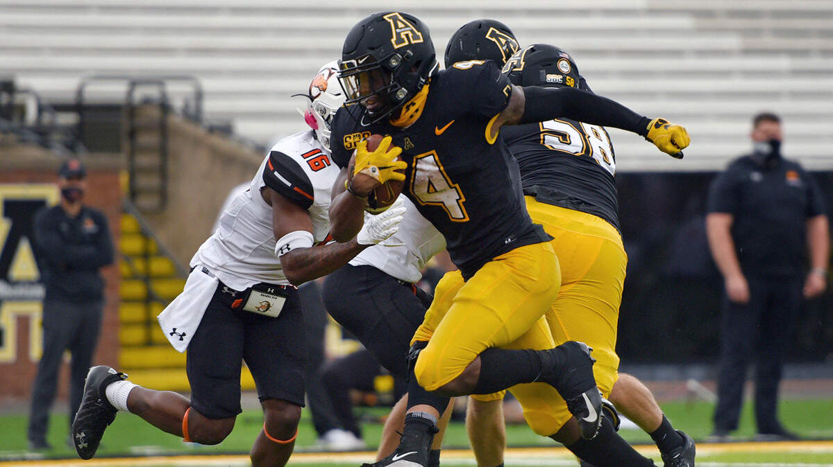 Appalachian St. running back Daetrich Harrington scores on a run during the second half of an NCAA college football game against Campbell, Saturday, Sept. 26, 2020 at Kidd Brewer Stadium in Boone, N.C. (Walt Unks/The Winston-Salem Journal via AP)
