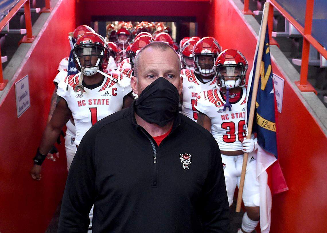 North Carolina State football coach Dave Doeren gets ready to head onto the field before their game against Syracuse at the Carrier Dome in Syracuse, Nov. 28, 2020.