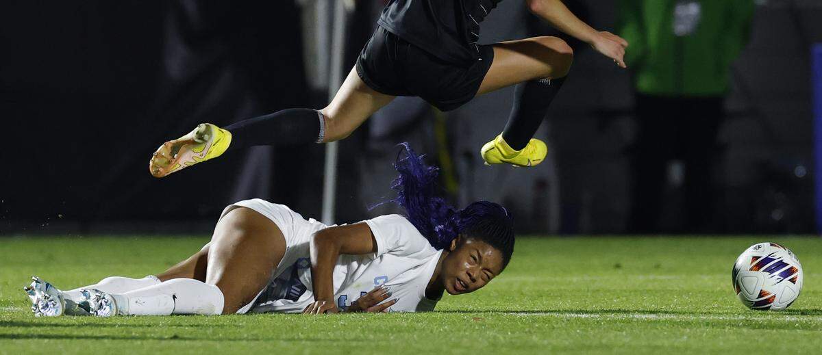 North Carolina’s Olivia Thomas (33) is fouled as Wake Forest’s Sierra Sythe (19) leaps over her during the second half of UNC’s 1-0 victory over Wake Forest in the finals of the 2024 Women’s College Cup at WakeMed Soccer Park in Cary, N.C., Monday, Dec. 9, 2024.