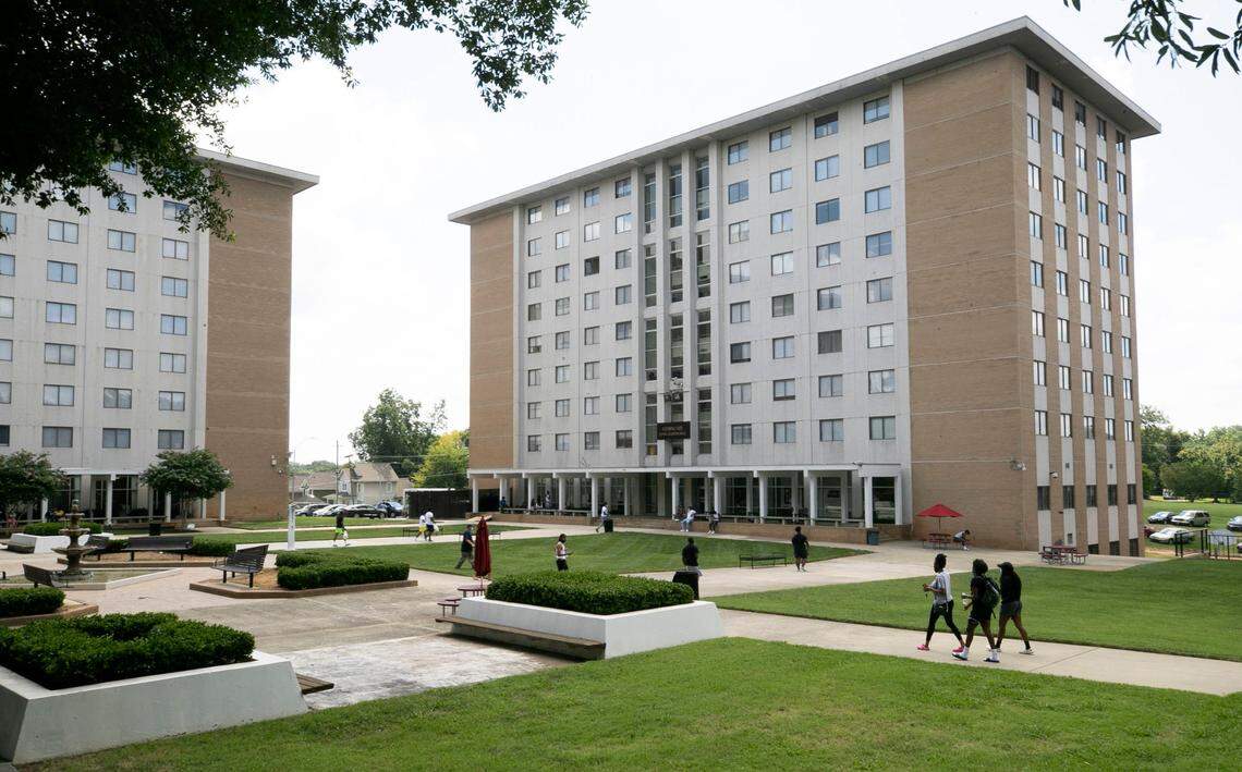 Shaw University students traverse the residential quad in front of the Fleming Kee Residence Hall on Tuesday, August 11, 2020 in Raleigh, N.C. Shaw will begin classes on August 12 amid the COVID-19 pandemic, with only about 50 percent of their student population on campus.