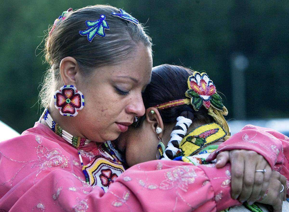 Faith Hedgepeth’s cousin Consuela Richardson, left, consoles Satarah Lewis, right, during a candlelight vigil at the Haliwa-Saponi Tribal School in Hollister to remember and pray for Faith Hedgepeth in 2012.