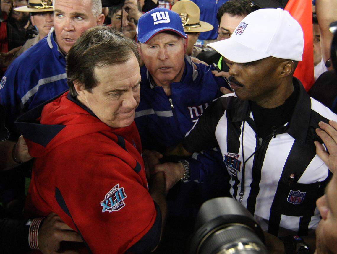 New England Patriots head coach Bill Belichick and New York Giants head coach Tom Coughlin shake hands after the Giants defeated the Patriots during Super Bowl XLII at the University of Phoenix Stadium in 2008.