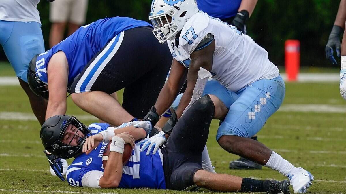UNC linebacker Chris Collins (17) sacks Duke quarterback Gunnar Holmberg (12) during the second half at Wallace Wade Stadium two weeks ago. Blue Devils coach David Cutcliffe is ready for his team to bounce back against Wake Forest after hitting ‘rock bottom.’