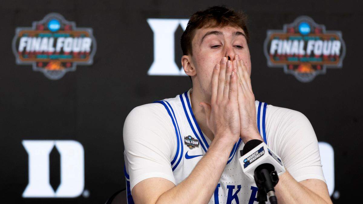 Duke forward Cooper Flagg (2) reacts as he takes a seat on the dais to field questions from the media following the Blue DevilsÕ 70-67 loss to Houston on Saturday, April 5, 2025 in the NCAA national semi final game at the Alamodome in San Antonio, TX.