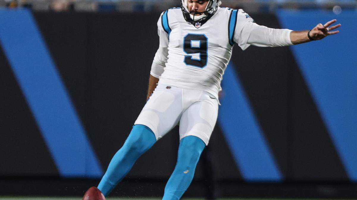 Carolina Panthers Ryan Santoso kicks at the Bank of America Stadium in Charlotte, N.C., on Friday, August 27, 2021.
