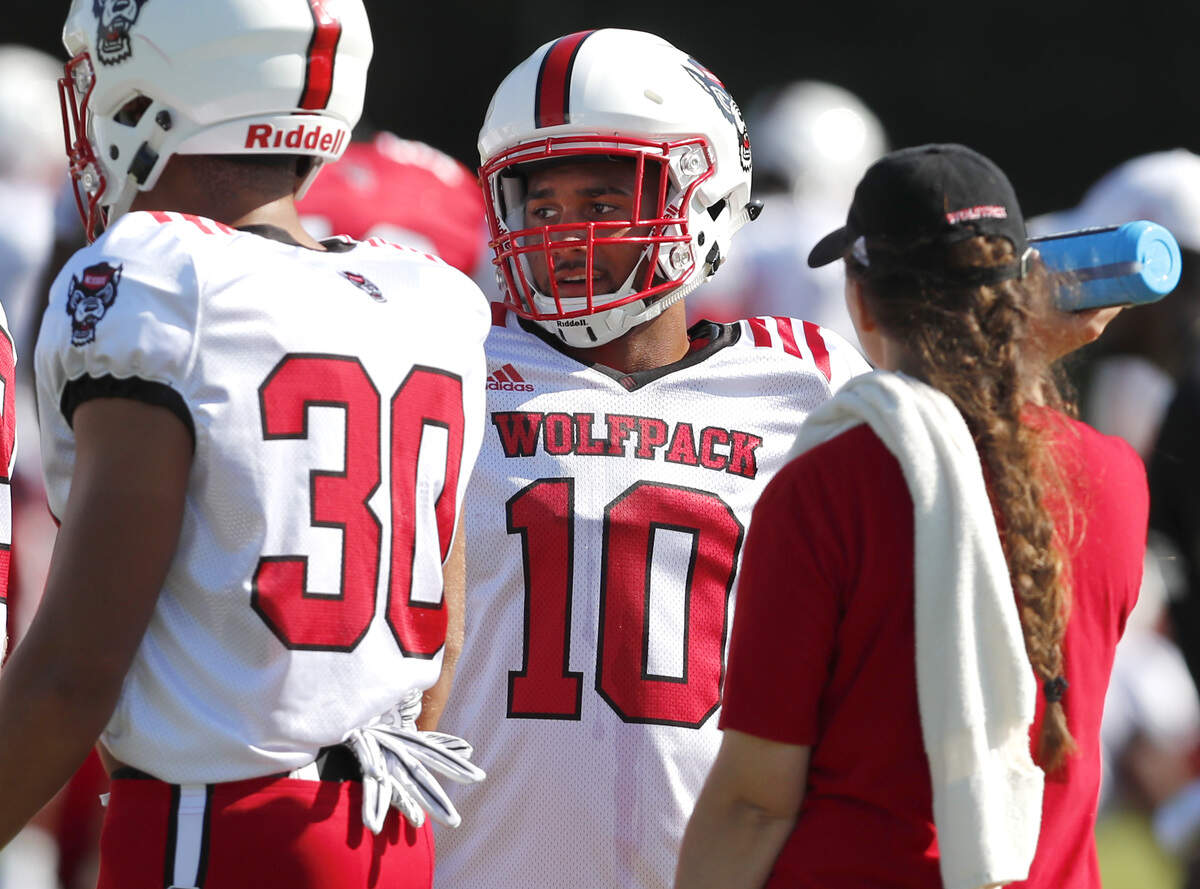 N.C. State’s Tanner Ingle (10) takes a break during the Wolfpack’s practice in Raleigh, N.C., Thursday, August 9, 2018.
