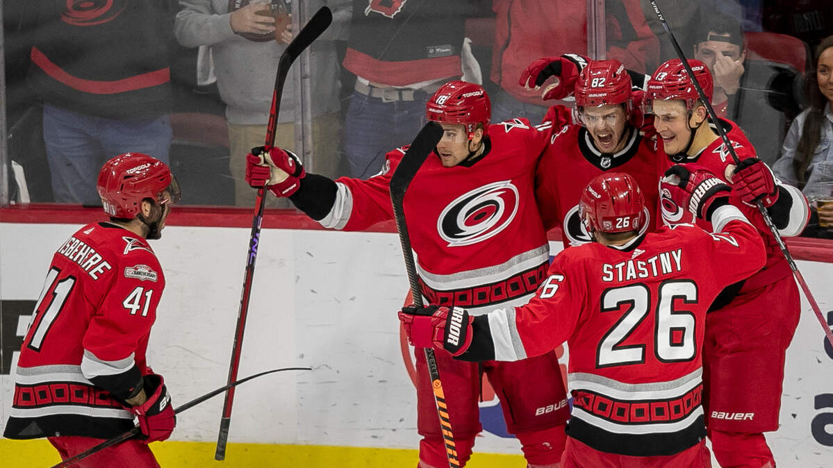 The Carolina Hurricanes Shayne Gostisbehere (41), Jack Drury (18) Jesse Piljujarvi (13) and Paul Stastny (26) congratulate Jesperi Kotkaniemi (82) after he scored the first of two goals against the New Jersey Devils goalie Akira Schmid (40) in the second period during Game 2 of their second round Stanley Cup playoff series on Friday, May 5, 2023 at PNC Arena in Raleigh, N.C.