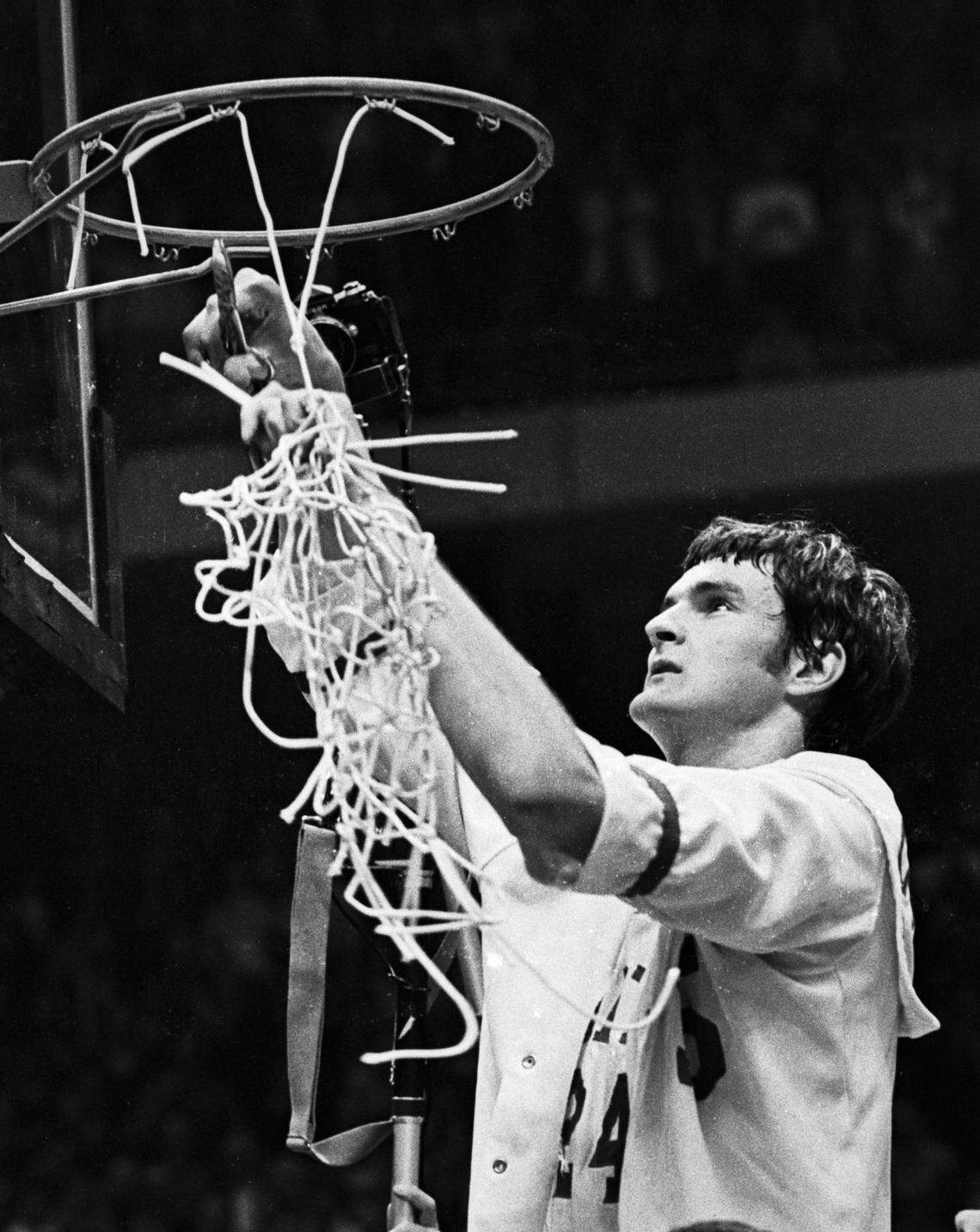 NC State center helps cut down the nets following the Wolfpack’s 1974 National Championship win over Marquette.