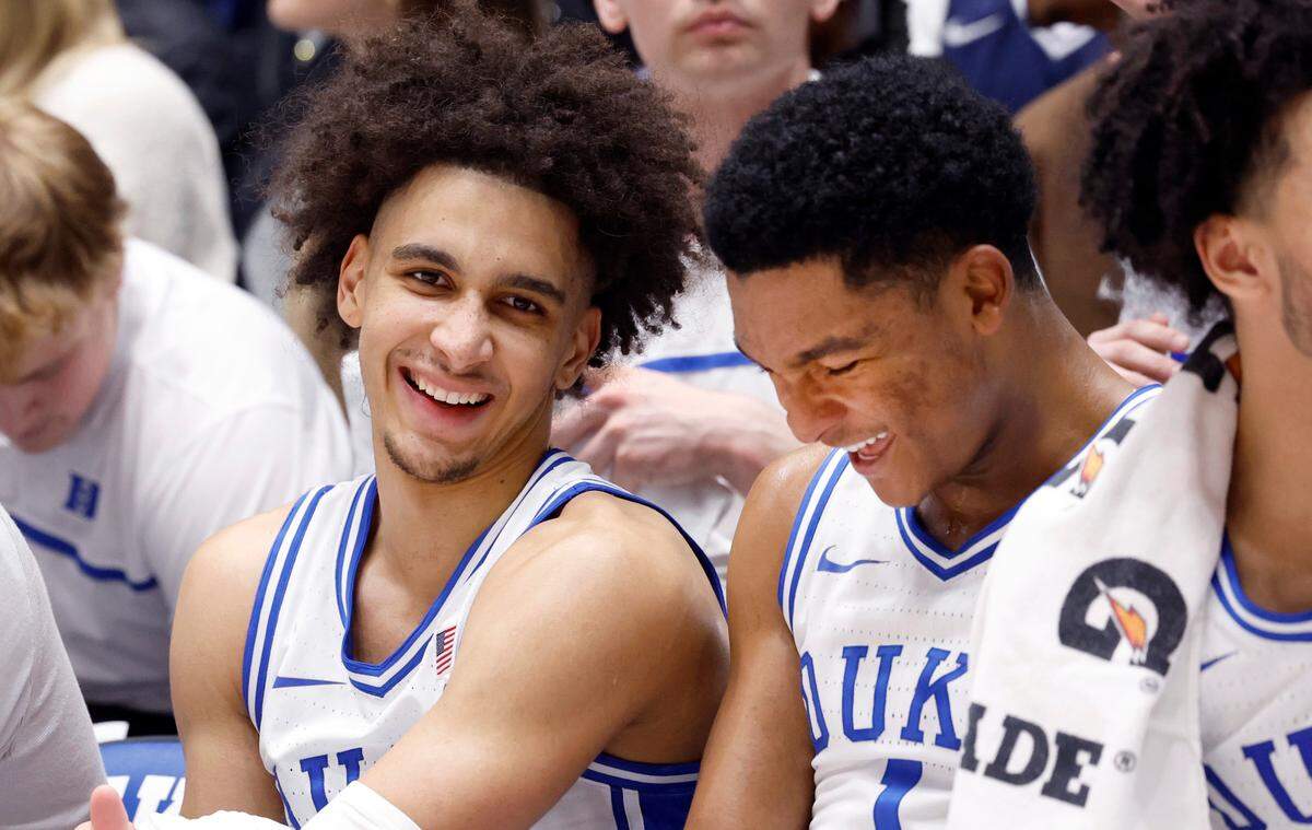 Duke’s Tyrese Proctor (5) laughs with Caleb Foster (1) during the second half of Duke’s 106-69 victory over Queens University at Cameron Indoor Stadium in Durham, N.C., Saturday, Dec. 30, 2023.