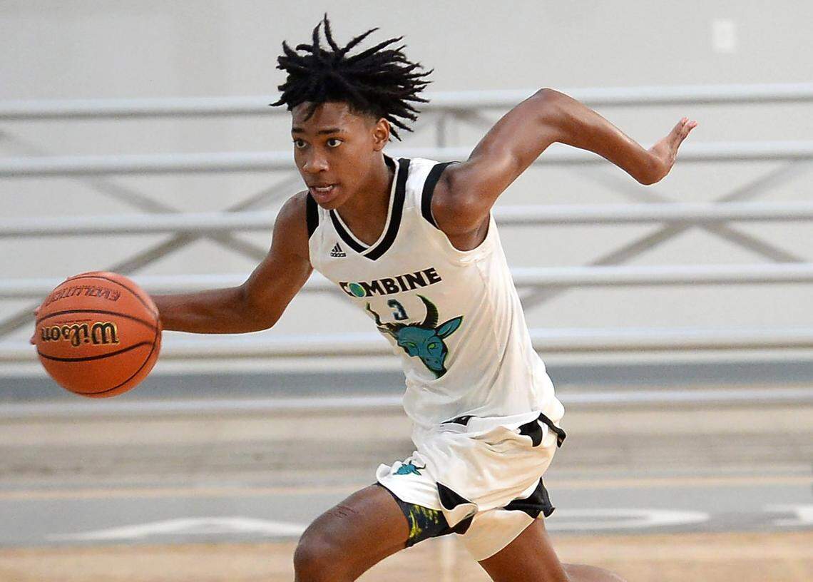 Combine Academy guard Robert Dillingham, left, pushes the ball upcourt during a practice game at Combine Academy in Lincolnton, NC on Wednesday, October 21, 2020.