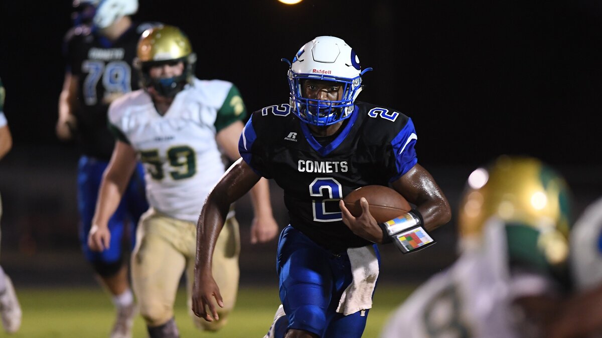 J.R. Walker (2) of Clayton carries the ball against the pursuit of Julian Purdin (59) of South Johnston. The South Johnston Trojans visited the Clayton Coments in a high school football game on October 5, 2018.