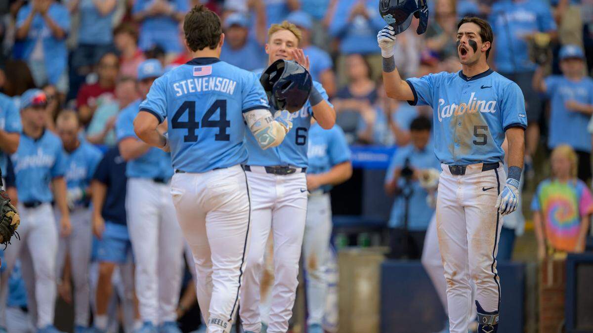 UNC’s Gavin Gallaher (5) and Jackson Van De Brake (6) celebrate after Luke Stevenson’s (44) home run during the Tar Heels’ 7-5 win over Florida State in the ACC Tournament semifinal on Saturday, May 24, 2025, at Durham Bulls Athletic Park in Durham, N.C.