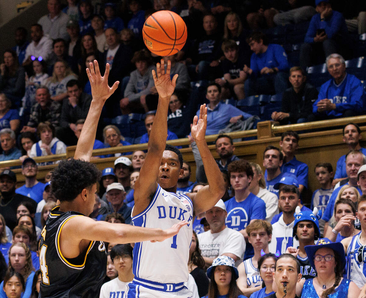 Duke’s Caleb Foster shoots over La Salle’s Tunde Vahlberg Fasasi during the first half of the Blue Devils’ 95-66 win on Tuesday, Nov. 21, 2023, at Cameron Indoor Stadium in Durham, N.C.