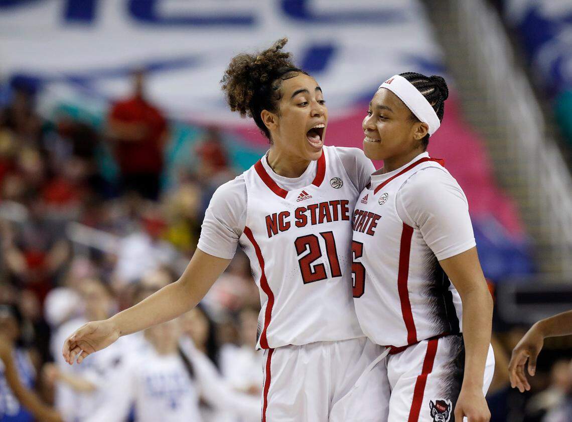 N.C. State’s Zoe Brooks (35) is congratulated by teammate Madison Hayes after knocking down a basket to give the Wolfpack a five point lead with less than a minute remaining in the second half of an ACC Tournament quarterfinal game against Duke on Friday, March 8, 2024, at Greensboro Coliseum in Greensboro, N.C.