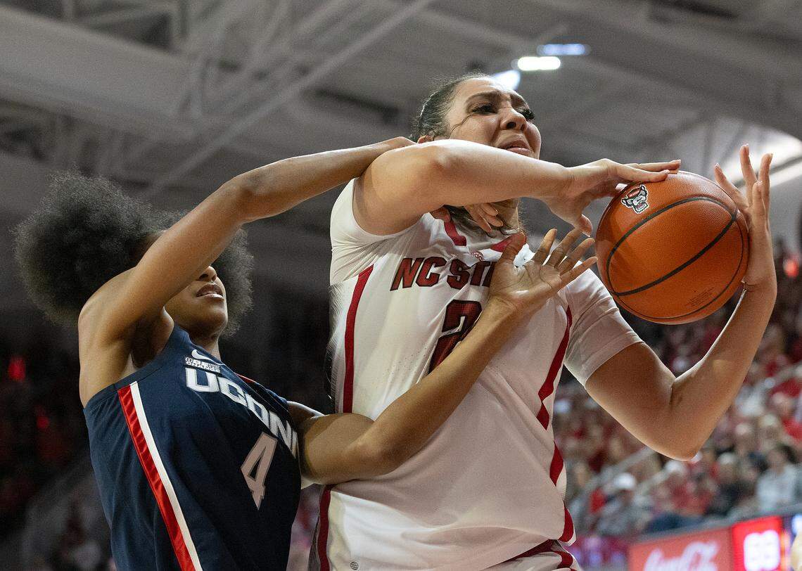 N.C. State’s Mimi Collins fights for possession with UConn’s Qadence Samuels during the second half of the Wolfpack’s 92-81 win on Sunday, Nov. 12, 2023, at Reynolds Coliseum in Raleigh, N.C.