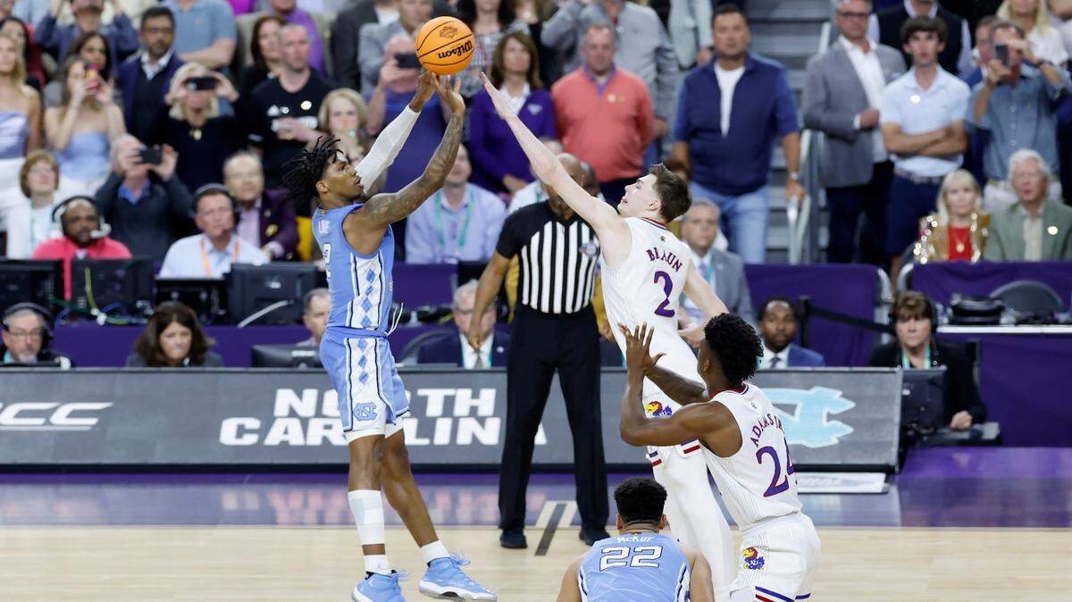 North Carolina’s Caleb Love (2) tries to hit a three-pointer as time runs out in Kansas’ 72-69 victory over UNC in the NCAA Men’s National Championship at the Caesars Superdome in New Orleans, La., Monday, April 4, 2022.