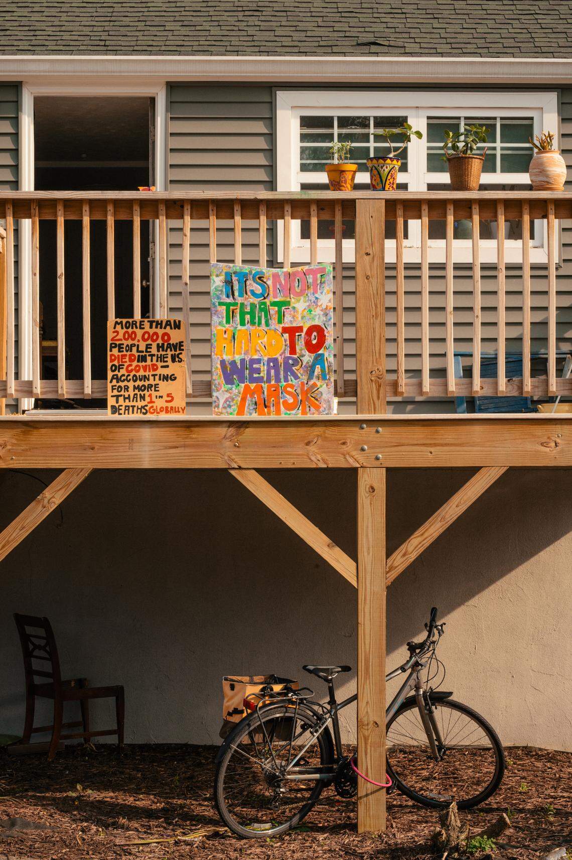 Handmade signs urging virus precautions adorned an apartment balcony near the Appalachian State University in Boone, N.C. on Sunday, Oct. 4, 2020. Cases of the coronavirus are spiking at the university causing many students and faculty members to call for stronger safety measures.