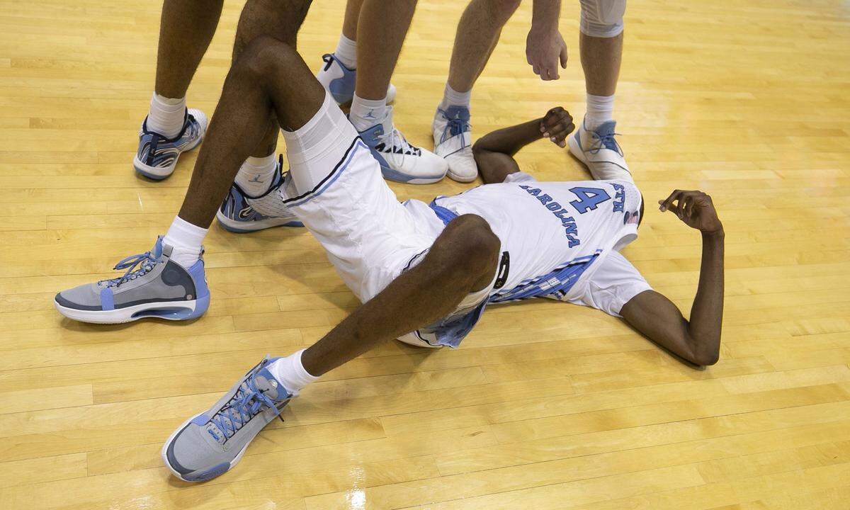North Carolina’s Brandon Robinson (4) coves his face after missing a final three-point attempt in overtime to tie Clemson at the buzzer. Clemson gets their first ever win in Chapel Hill, a 79-76 overtime victory on Saturday, January 11, 2020 in Chapel Hill, N.C.