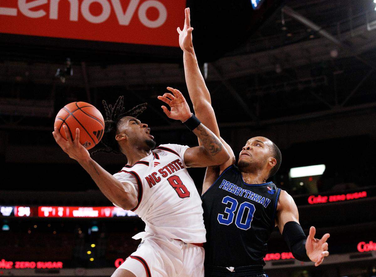 N.C. State’s Jayden Taylor drives to the basket against Presbyterian’s Kaleb Scott during the first half of the Wolfpack’s game on Friday, Nov. 8, 2024, at Lenovo Center in Raleigh, N.C.