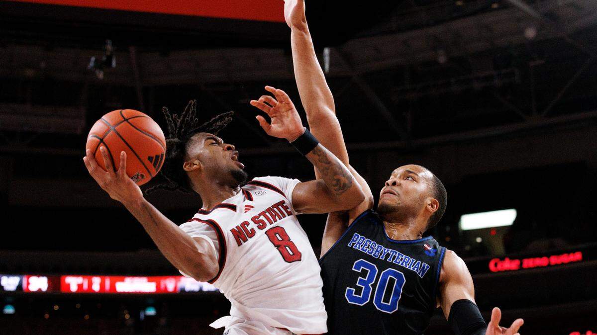 N.C. State’s Jayden Taylor drives to the basket against Presbyterian’s Kaleb Scott during the first half of the Wolfpack’s game on Friday, Nov. 8, 2024, at Lenovo Center in Raleigh, N.C.