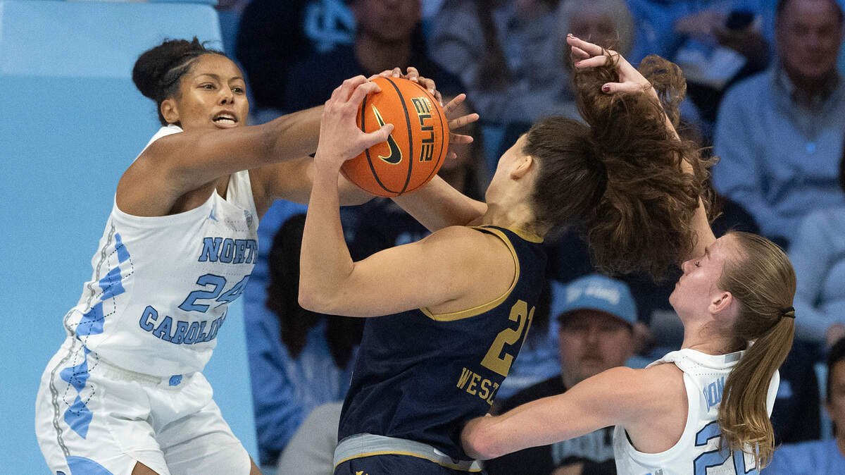 North Carolina’s Indya Nivar and Lexi Donarski pressure Notre Dame’s Maddy Westbeld during the first half of the Tar Heels’ game at Carmichael Arena on Sunday, Jan. 5, 2025, in Chapel Hill, N.C.