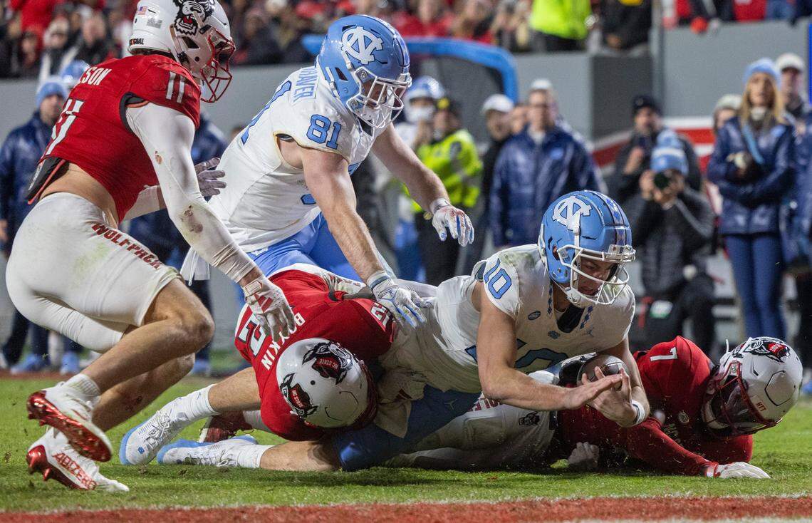 North Carolina quarterback Drake Maye (10) scores a touchdown on a one yard run in the third quarter against N.C. State on Saturday, November 25, 2023 at Carter-Finley Stadium in Raleigh, N.C.