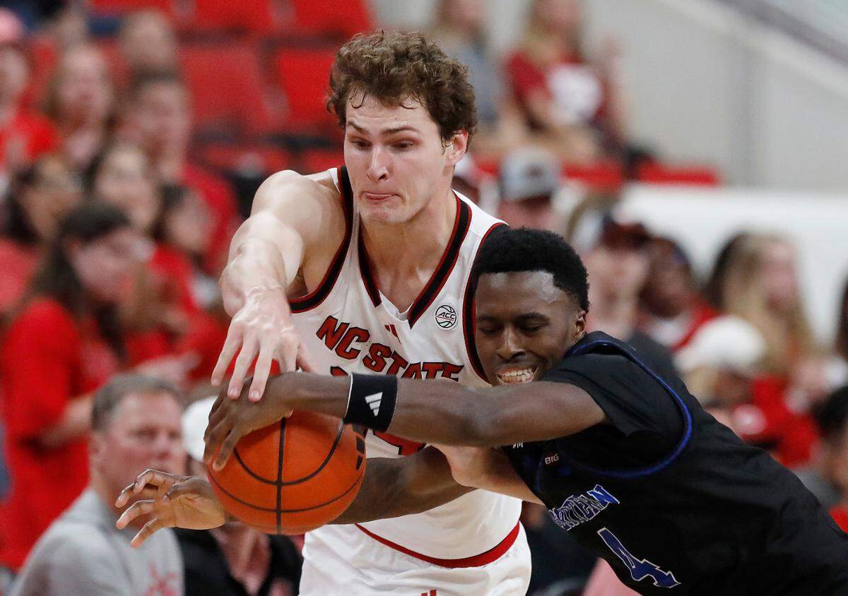 N.C. State’s Ben Middlebrooks forces a turnover by Presbyterian’s Kory Mincy during the second half of the Wolfpack’s 81-72 win on on Friday, Nov. 8, 2024, at Lenovo Center in Raleigh, N.C.