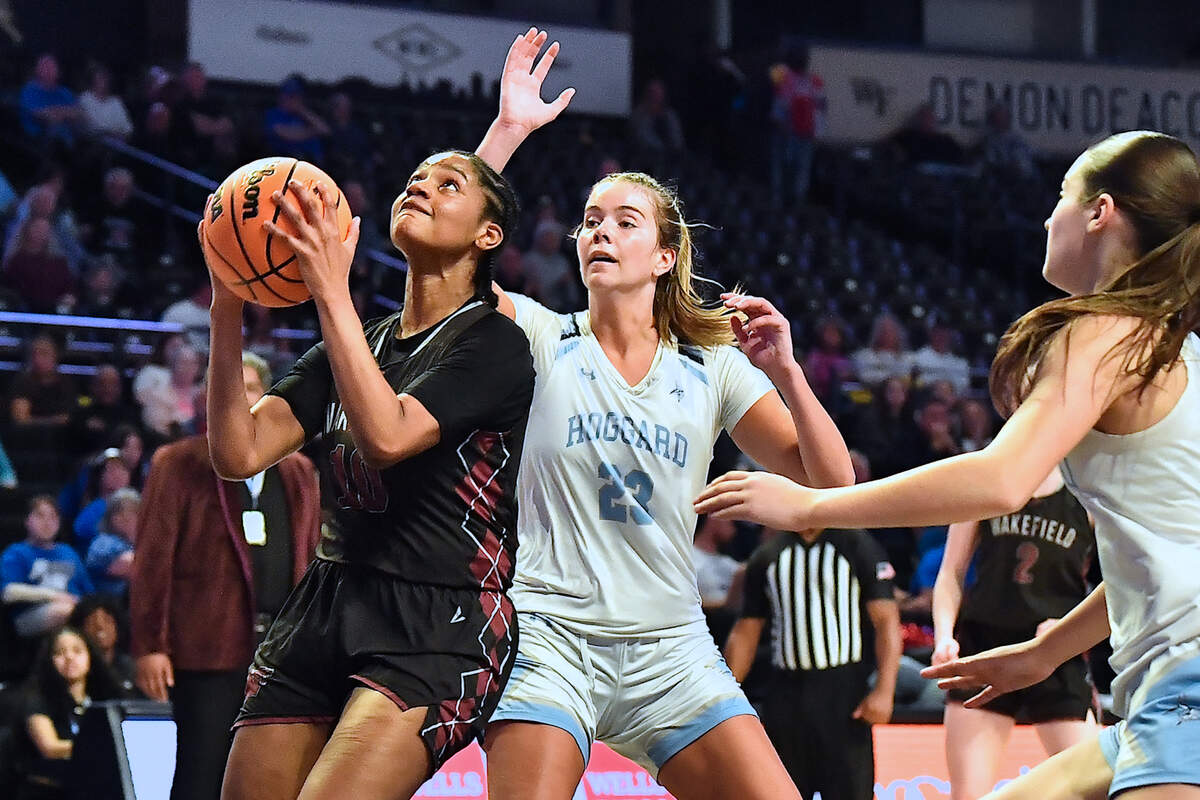 Wakefield’s Jaya Hamilton (10) looks to shoot ahead of Hoggard’s Avery Fitzgerald (23) during the second half. The Wakefield Wolverines and the Hoggard Vikings met in the NCHSAA 4A East Regional Final in Winston-Salem, N.C. on March 12, 2025. Wakefield wins 31-23.