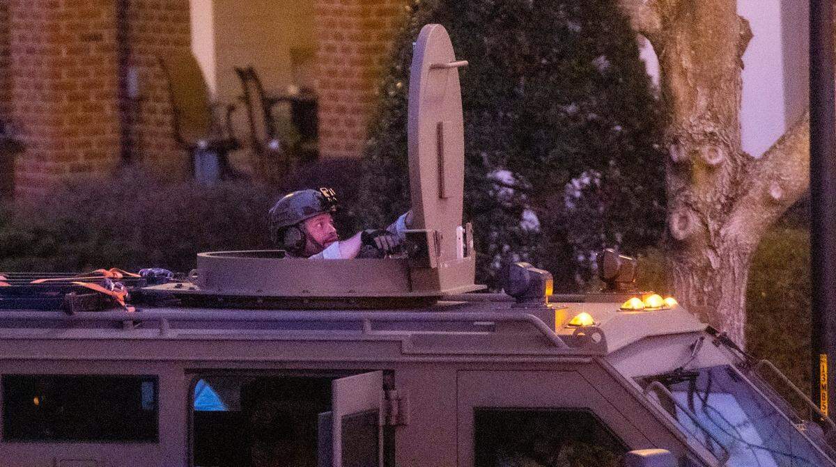 Law enforcement officers work the scene of a standoff at Tryon Villages apartments in Cary Wednesday, Feb. 22, 2023.