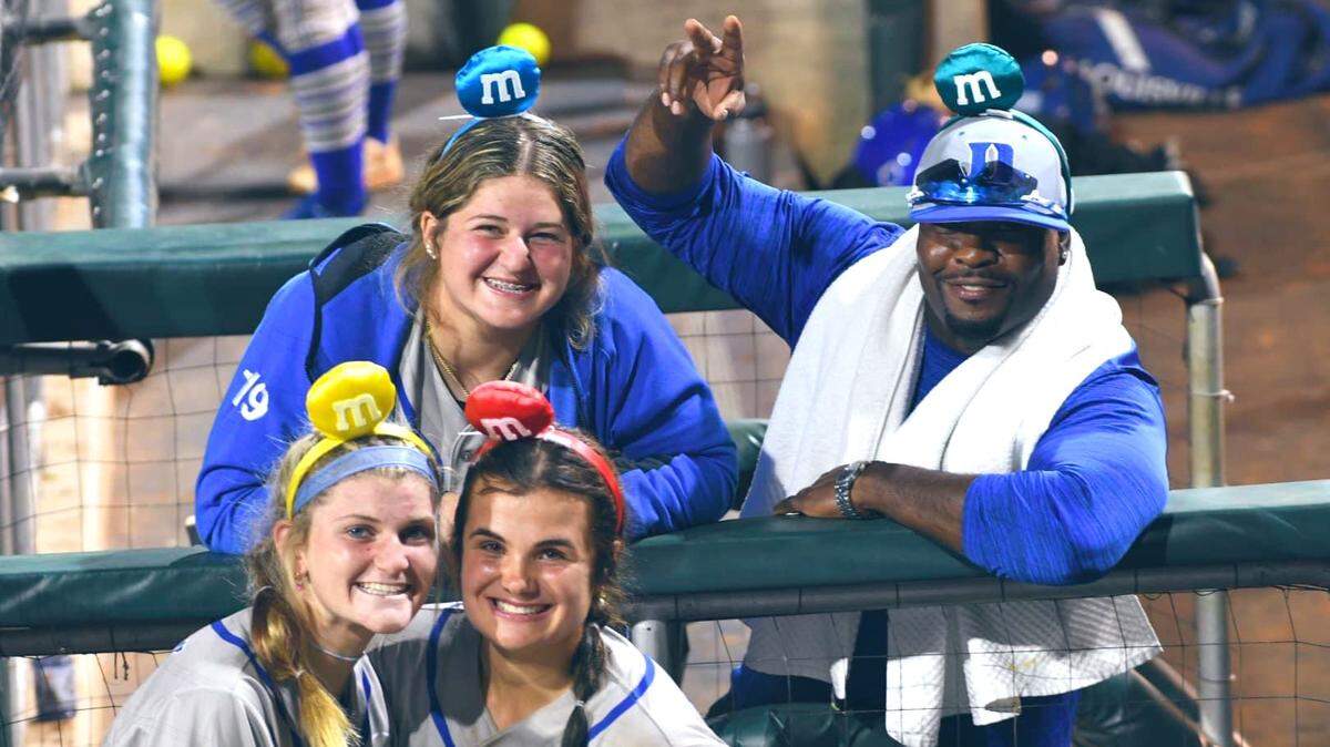 James Lamar, Duke softball coach Marissa Young’s husband, clowns around with Blue Devils players. Lamar is intensive care at Duke University Hospital in need of heart and kidney transplants.