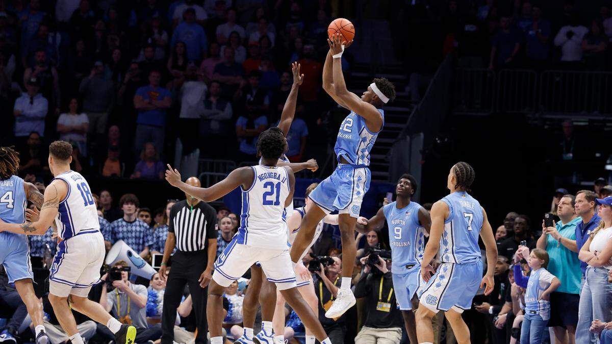 North Carolina’s Ven-Allen Lubin (22) tries for a three-pointer as time runs down in Duke’s 74-71 victory over UNC in the semifinals of the 2025 ACC Men’s Basketball Tournament at the Spectrum Center in Charlotte, N.C., Friday, March 14, 2025.