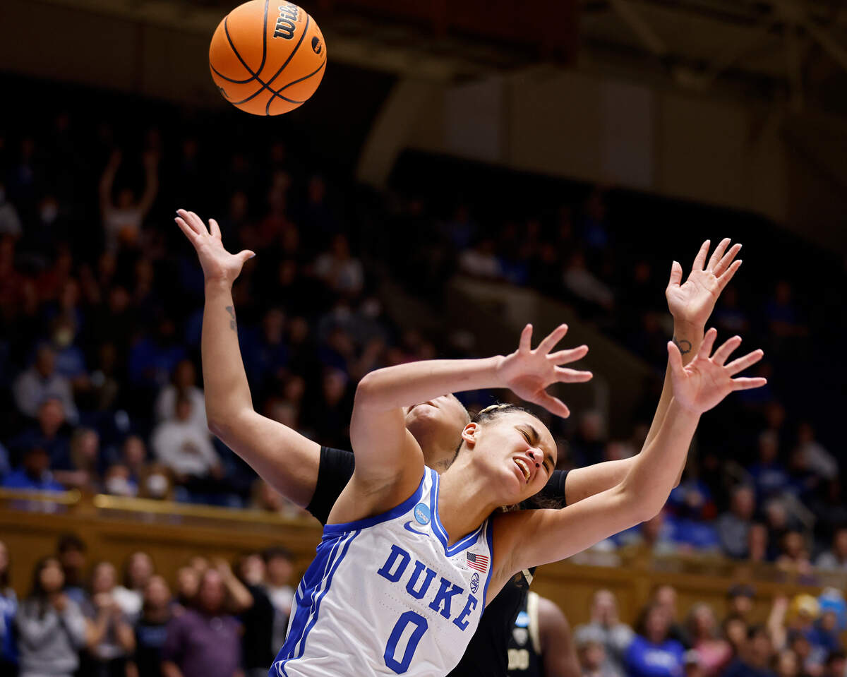 Duke’s Celeste Taylor and Colorado’s Quay Miller battle for possession during the first half of an NCAA Tournament second round game at Cameron Indoor Stadium on Monday, March 20, 2023, in Durham, N.C.