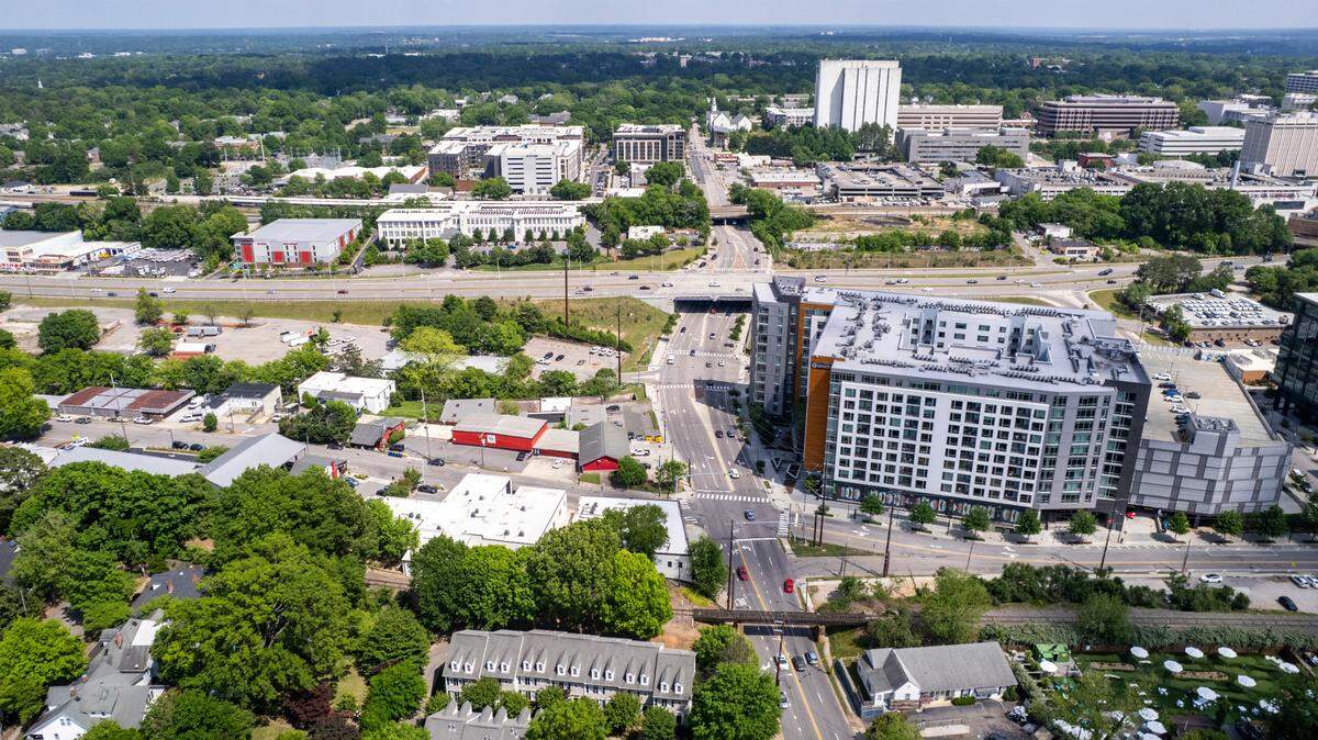 An aerial view of the Smoky Hollow district in Raleigh shows the site where construction of 27-story tower is being proposed across from a 12-story high-rise that currently houses apartments and Publix near the historic Glenwood-Brooklyn neighborhood bordering the northern edge of downtown Raleigh.