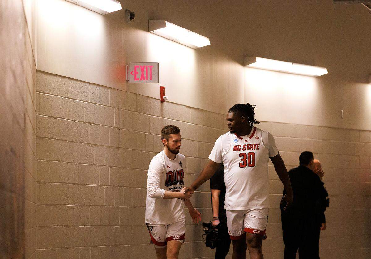 N.C. State’s Alex Nunnally and DJ Burns, Jr. walk the tunnel to the court prior to the Wolfpack’s NCAA Tournament second round game against Oakland on Saturday, March 23, 2024, at PPG Paints Arena in Pittsburgh, Pa.